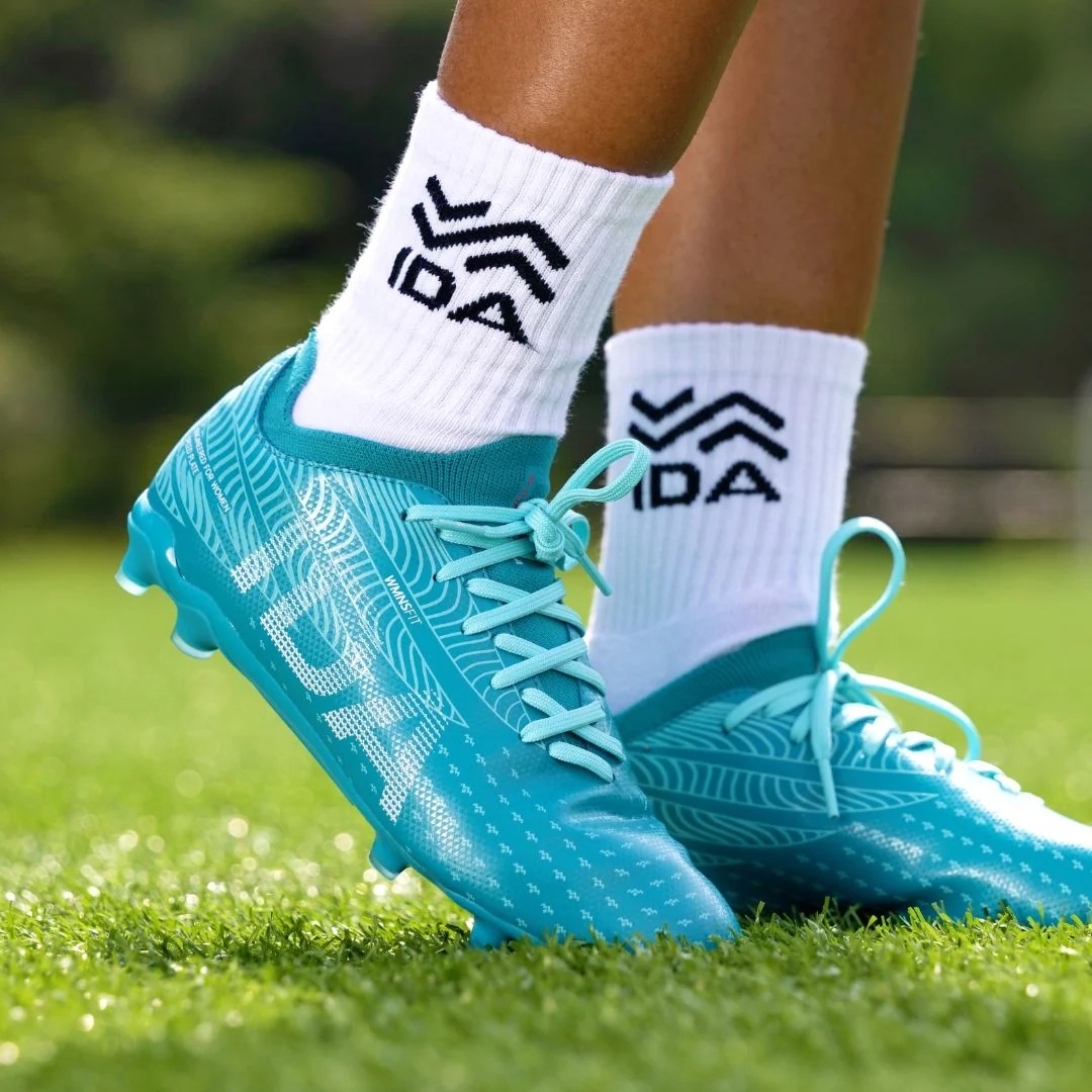 IDA Helia Club FG/AG Blue soccer cleats, on-field lifestyle view