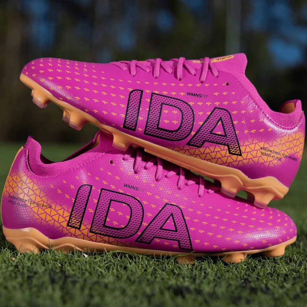 IDA Helia Club FG/AG Dark Pink soccer cleats, on-grass lifestyle view